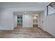 Open basement space with vinyl floors, recessed lighting, and a doorway to an adjacent bathroom at 3880 Northpoint Dr, Marietta, GA 30062