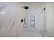 Modern bathroom with a frameless glass shower, soaking tub, and elegant marble tiling at 3880 Northpoint Dr, Marietta, GA 30062