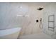 Modern bathroom with a frameless glass shower, soaking tub, and elegant marble tiling at 3880 Northpoint Dr, Marietta, GA 30062