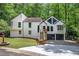 Stunning exterior with modern architectural elements and a two-car garage in a serene, wooded setting at 3880 Northpoint Dr, Marietta, GA 30062