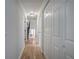 Hallway with hardwood floors, closet and view of the staircase at 3880 Northpoint Dr, Marietta, GA 30062