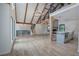 Open floor plan features hardwood floors, wood beams, vaulted ceilings, staircase, and kitchen island at 3880 Northpoint Dr, Marietta, GA 30062
