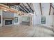 Bright living room with stone fireplace, exposed beams, and an open layout at 3880 Northpoint Dr, Marietta, GA 30062