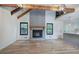 Open-concept living room with a stone fireplace, vaulted ceilings, and hardwood floors at 3880 Northpoint Dr, Marietta, GA 30062