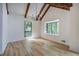 Bright living room features hardwood floors, cathedral ceilings, modern lighting, and multiple windows at 3880 Northpoint Dr, Marietta, GA 30062
