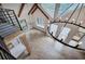 Open living room with cathedral ceilings, chandelier, wood beams, many windows, hardwood floors and staircase at 3880 Northpoint Dr, Marietta, GA 30062