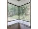 Corner window seat provides an excellent view of the wooded landscaping at 3880 Northpoint Dr, Marietta, GA 30062