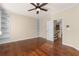 Bedroom boasts hardwood floors, recessed lighting, built-in shelves, and stair access at 4656 Ivygate Se Cir, Atlanta, GA 30339