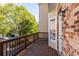 Private deck featuring wooden railing with scenic views and a brick wall at 4656 Ivygate Se Cir, Atlanta, GA 30339