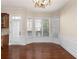 Bright dining area with bay windows, hardwood floors, and elegant molding at 4656 Ivygate Se Cir, Atlanta, GA 30339