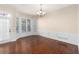 Dining room featuring a large bay window and classic trim work, complemented by hardwood flooring at 4656 Ivygate Se Cir, Atlanta, GA 30339