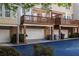 The back of the home features outdoor decks and two car garages at 4656 Ivygate Se Cir, Atlanta, GA 30339