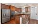 Well-equipped kitchen boasts stainless steel appliances, wood cabinets, granite countertops, and an island at 4656 Ivygate Se Cir, Atlanta, GA 30339