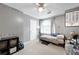 Bedroom featuring gray walls, neutral carpet, white window and a ceiling fan at 5531 Hurstcliffe Nw Dr, Kennesaw, GA 30152