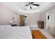 Spacious main bedroom features a tray ceiling and sliding barn door to ensuite bath at 5531 Hurstcliffe Nw Dr, Kennesaw, GA 30152