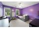 Bedroom featuring purple walls, neutral carpet, white windows and a ceiling fan at 5531 Hurstcliffe Nw Dr, Kennesaw, GA 30152