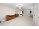 Bonus room featuring neutral carpet and paint with projector for entertainment at 5531 Hurstcliffe Nw Dr, Kennesaw, GA 30152