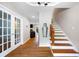 Welcoming foyer with hardwood floors and staircase at 5531 Hurstcliffe Nw Dr, Kennesaw, GA 30152