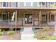 Charming front porch with stone accents and wooden railing details at 5531 Hurstcliffe Nw Dr, Kennesaw, GA 30152