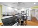 Bright kitchen with white cabinets, granite counters, island seating, and stainless appliances at 5531 Hurstcliffe Nw Dr, Kennesaw, GA 30152