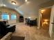 Bonus room featuring dark wood chairs and table, television, and neutral paint at 3397 Holly Glen Dr, Dacula, GA 30019