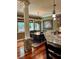 Eat-in kitchen features a dark wood table, chandelier and granite countertops at 3397 Holly Glen Dr, Dacula, GA 30019