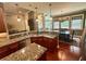 Kitchen area with stone counters, bar seating, and open layout at 3397 Holly Glen Dr, Dacula, GA 30019