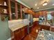 Kitchen features stone counters, stainless appliances, and dark wood cabinets at 3397 Holly Glen Dr, Dacula, GA 30019
