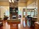 Open living room featuring a stone fireplace, wood floors, and lots of natural light at 3397 Holly Glen Dr, Dacula, GA 30019