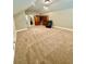 Large main bedroom featuring neutral carpet, dual wood cabinets, and a comfortable reading chair at 3397 Holly Glen Dr, Dacula, GA 30019