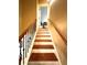 Staircase features dark wooden handrail and spindles, and bright white trim at 3397 Holly Glen Dr, Dacula, GA 30019