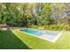 Backyard featuring a stunning swimming pool and a beautiful lawn for relaxation at 4785 Brinkley Ln, Atlanta, GA 30342