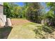 Spacious backyard featuring a lush lawn and landscaped hillside, perfect for outdoor activities and relaxation at 4785 Brinkley Ln, Atlanta, GA 30342