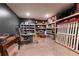 Finished basement with storage shelving, a desk, and room for organization at 4785 Brinkley Ln, Atlanta, GA 30342