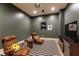 Finished basement media room with two leather chairs and a striped rug at 4785 Brinkley Ln, Atlanta, GA 30342