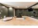 Finished basement featuring a treadmill, large wall mirror, and space for exercise at 4785 Brinkley Ln, Atlanta, GA 30342