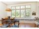 Bright dining area featuring a window bench, wooden dining table, and stylish decor at 4785 Brinkley Ln, Atlanta, GA 30342