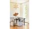 Inviting foyer with natural light, hardwood floors, and a statement chandelier at 4785 Brinkley Ln, Atlanta, GA 30342