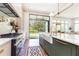 Chef's kitchen featuring professional-grade appliances, marble countertops, and a garden view at 4785 Brinkley Ln, Atlanta, GA 30342