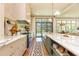 Gourmet kitchen with premium appliances, marble counters, and seamless flow to living spaces at 4785 Brinkley Ln, Atlanta, GA 30342