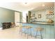 Modern bar with stools, and easy access to the stairs at 4785 Brinkley Ln, Atlanta, GA 30342