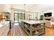 Gourmet kitchen featuring a large island, custom cabinetry, and high-end appliances at 4785 Brinkley Ln, Atlanta, GA 30342