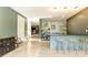 Features a modern bar with stools, and easy access to the stairs at 4785 Brinkley Ln, Atlanta, GA 30342