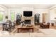 Elegant living room showcasing a stone fireplace, built-in shelving, and ample seating at 4785 Brinkley Ln, Atlanta, GA 30342