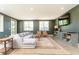 Inviting living room features a modern couch and ample seating with natural light at 4785 Brinkley Ln, Atlanta, GA 30342