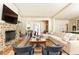 Expansive open-concept living space featuring a stone fireplace and seamless transitions at 4785 Brinkley Ln, Atlanta, GA 30342