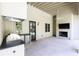 Outdoor kitchen and fireplace with stone flooring, ideal for entertaining at 4785 Brinkley Ln, Atlanta, GA 30342