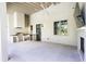 Outdoor kitchen with stainless steel grill, countertop, and fireplace at 4785 Brinkley Ln, Atlanta, GA 30342