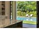 Kitchen view to pool and lounge chairs at 4785 Brinkley Ln, Atlanta, GA 30342