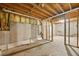 Unfinished basement featuring bare concrete walls, exposed pipes, and wooden framing at 930 Palmer Rd, Lithonia, GA 30058